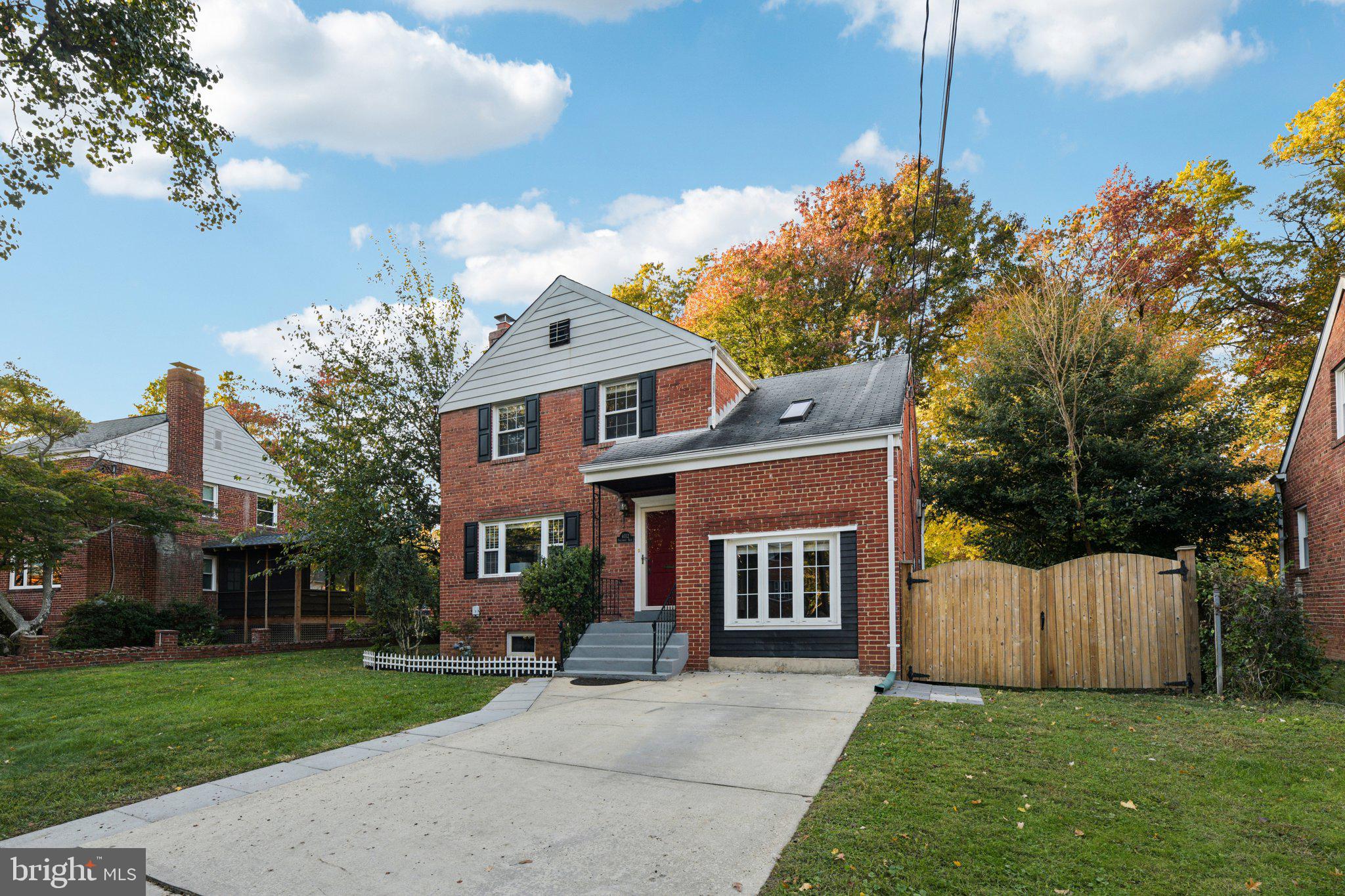 4012 Beechwood Road University Park, MD 20782 - Photo 50 of 56 a front view of a house with a garden and yard