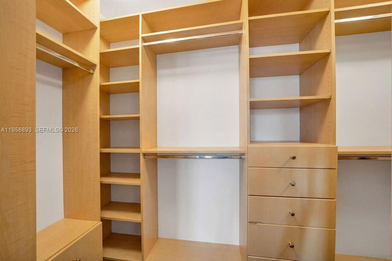 2654 Southwest 31st Place, Unit 2654 Miami, FL 33133 - Photo 11 of 17 a view of walk in closet with empty racks