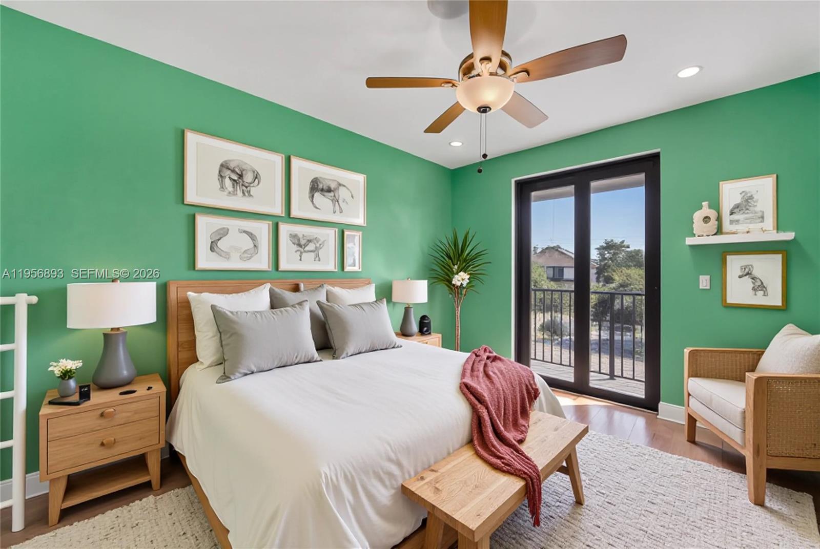 2654 Southwest 31st Place, Unit 2654 Miami, FL 33133 - Photo 14 of 17 a bedroom with a bed wooden floor and furniture