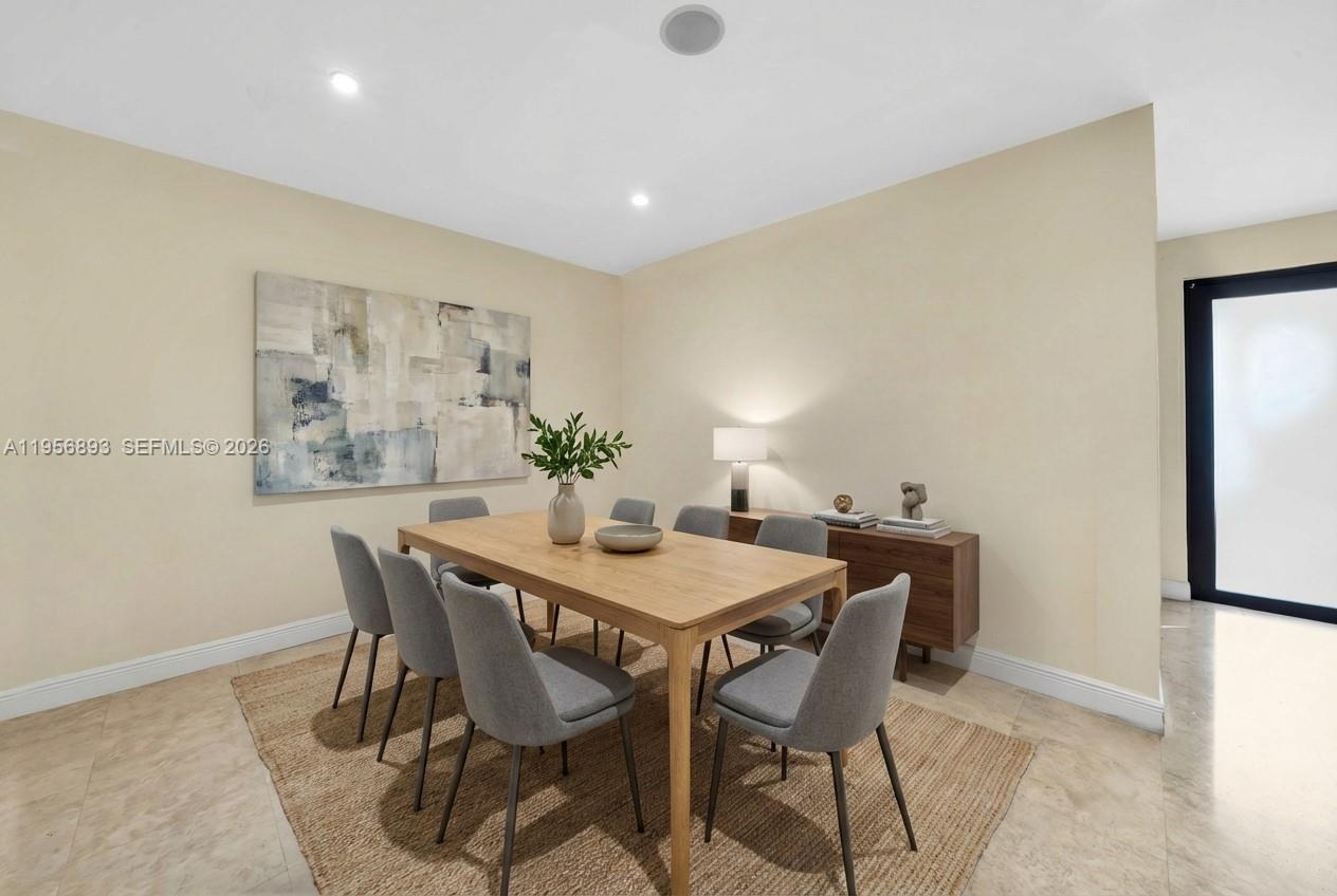 2654 Southwest 31st Place, Unit 2654 Miami, FL 33133 - Photo 6 of 17 a view of a dining room with furniture and window