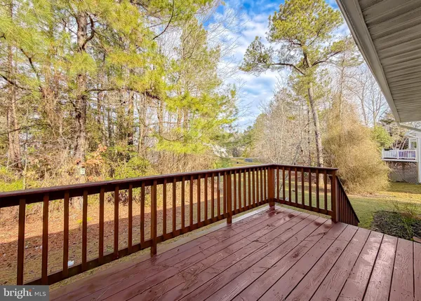 a view of balcony with wooden floor
