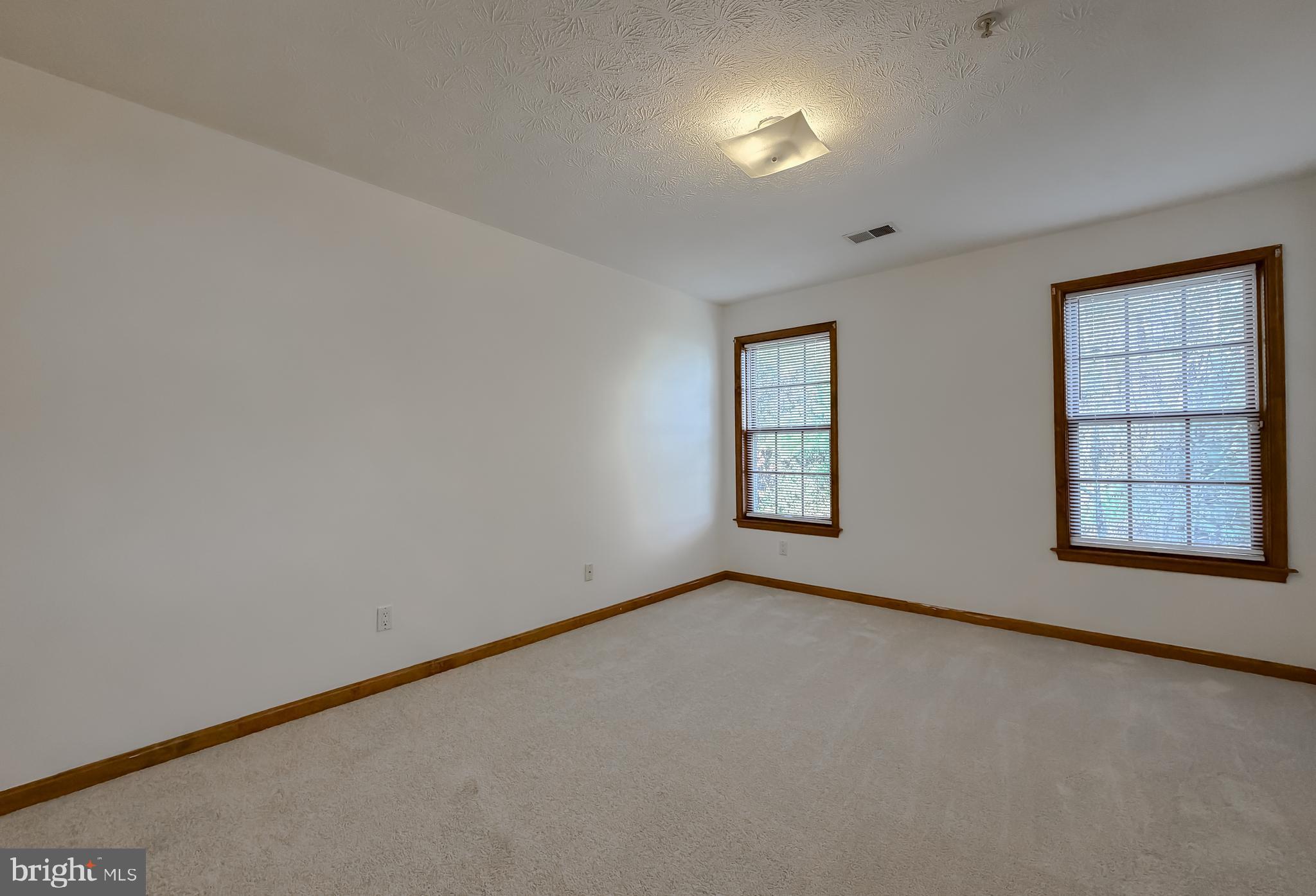 44029 Fieldstone Way California, MD 20619 - Photo 9 of 37 an empty room with windows