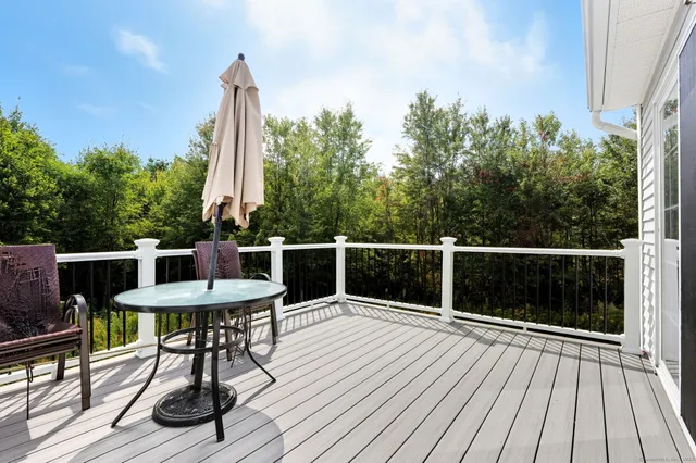 a view of a chairs on the roof deck