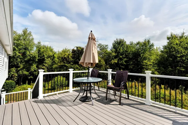 a view of balcony with furniture and wooden floor