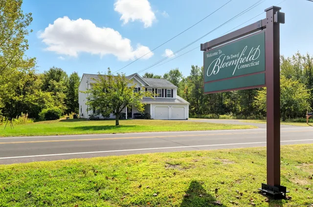 a view of a building next to a yard