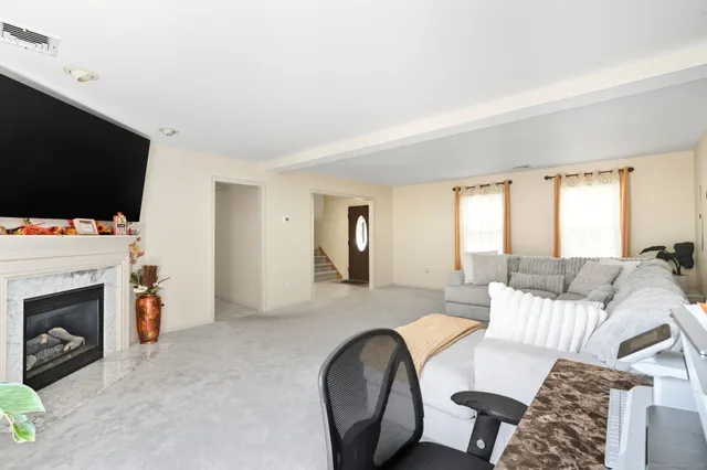 a bathroom with a sink a toilet and a window