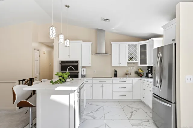 a view of a livingroom with furniture and window