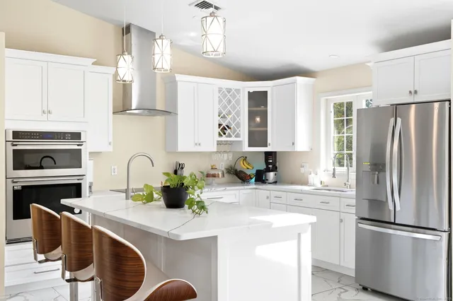 a view of dining room with furniture and a potted plant