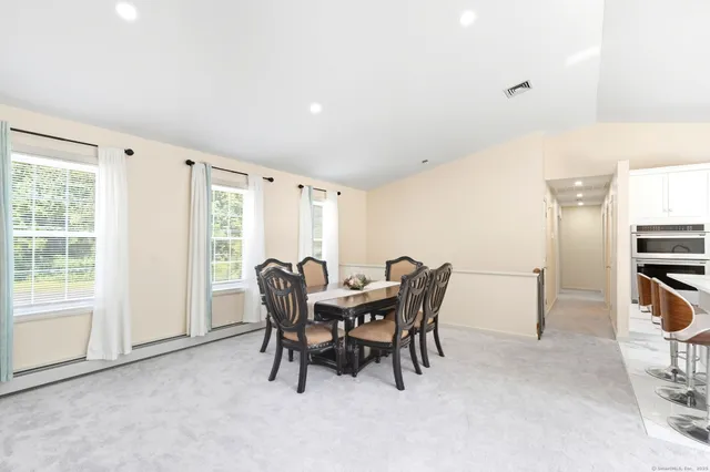 a view of a dining room with furniture