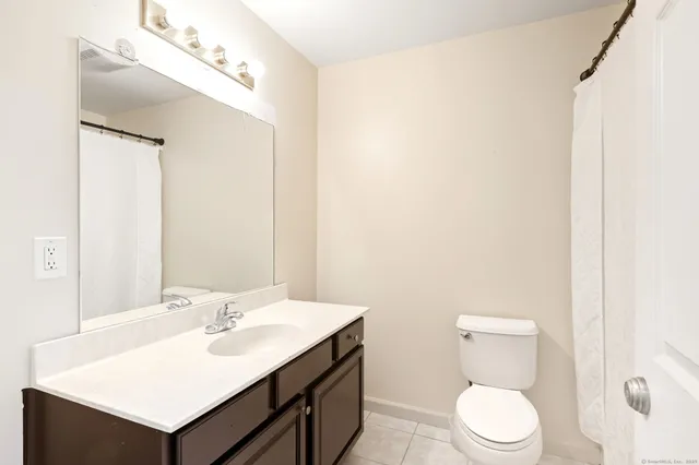 a view of a bedroom with furniture and windows