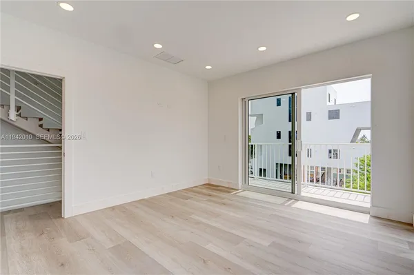 a view of entryway with wooden floor