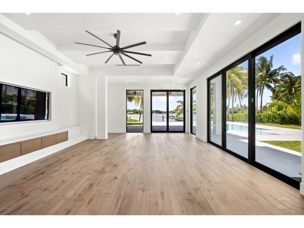 19311 North Riverside Drive Tequesta, FL 33469 - Photo 18 of 31 a view of an empty room with window and wooden floor