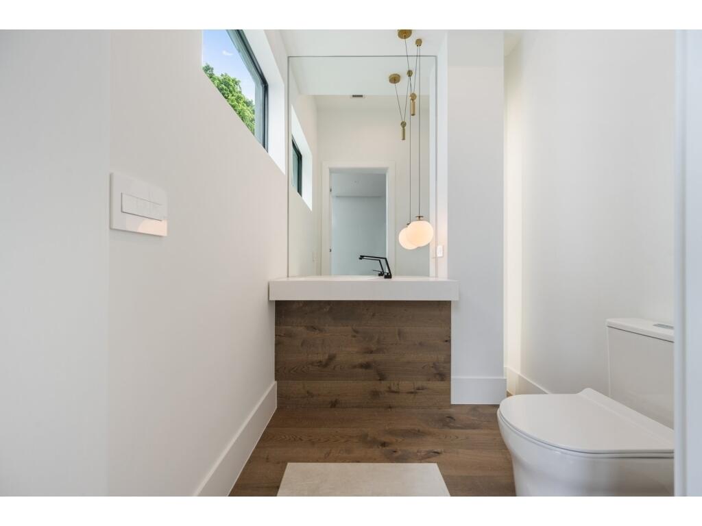 19311 North Riverside Drive Tequesta, FL 33469 - Photo 26 of 31 a bathroom with a sink and a mirror