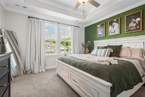 a bed room with a bed and a window