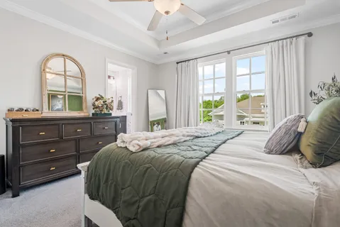 a bedroom with a bed and a dresser