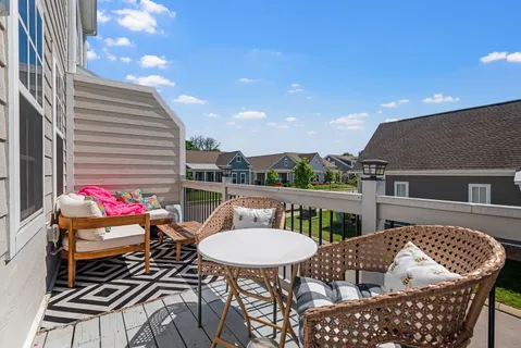 a view of a patio in the backyard