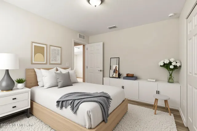 a large white bed in a white room