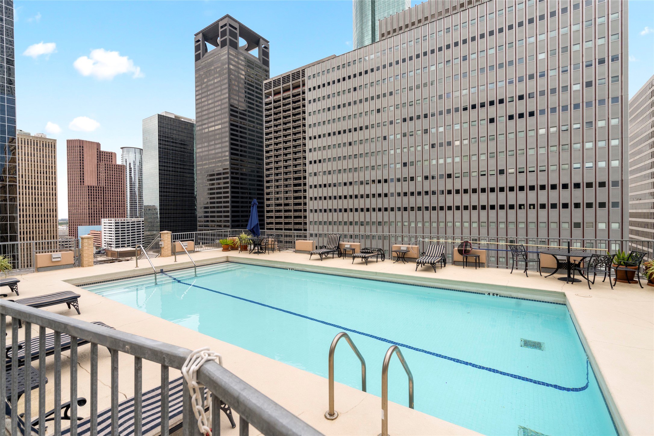 914 Main Street, Unit 1008 Houston, TX 77002 - Photo 4 of 26 Enjoy panoramic city skyline views on the 15th floor roof top pool, an urban oasis above it all.