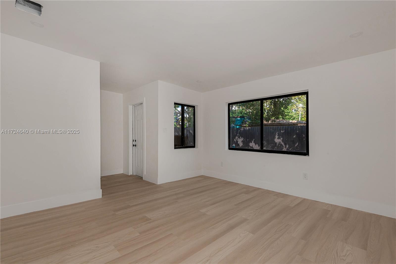 Coral Gate Miami, FL 33135 - Photo 13 of 23 an empty room with wooden floor and windows