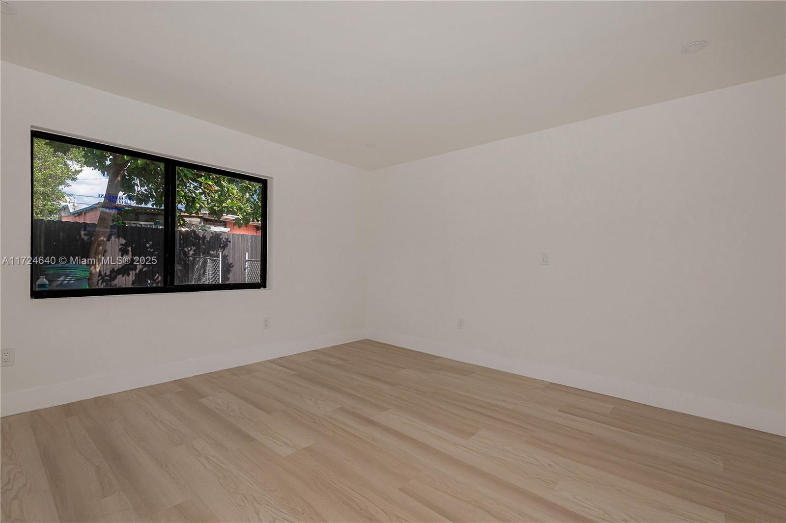 Coral Gate Miami, FL 33135 - Photo 14 of 23 a view of empty room with wooden floor and fan