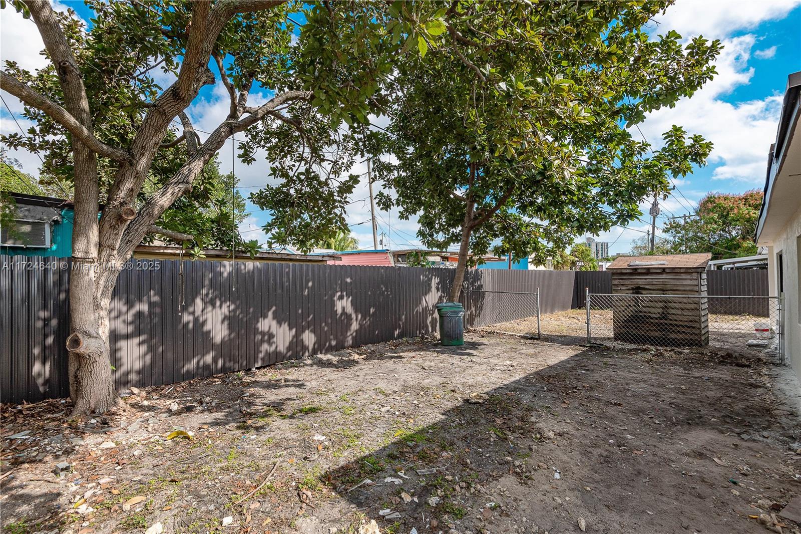 Coral Gate Miami, FL 33135 - Photo 5 of 23 a view of backyard with wooden fence and a large tree