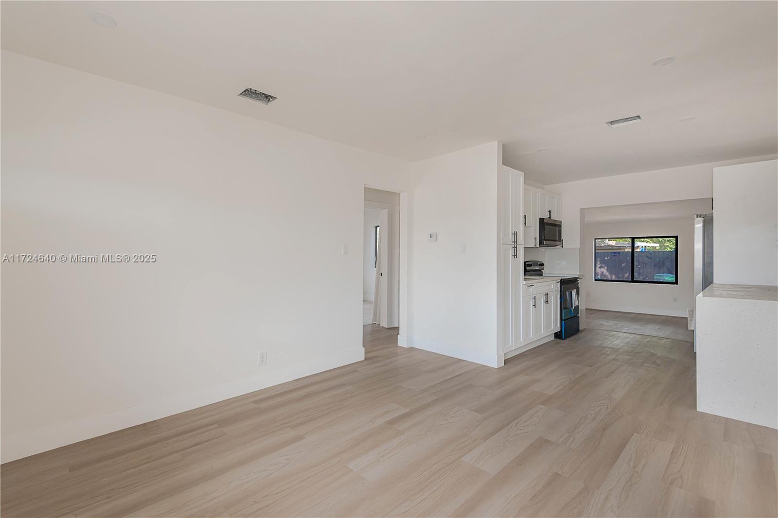 Coral Gate Miami, FL 33135 - Photo 7 of 23 a view of empty room with wooden floor