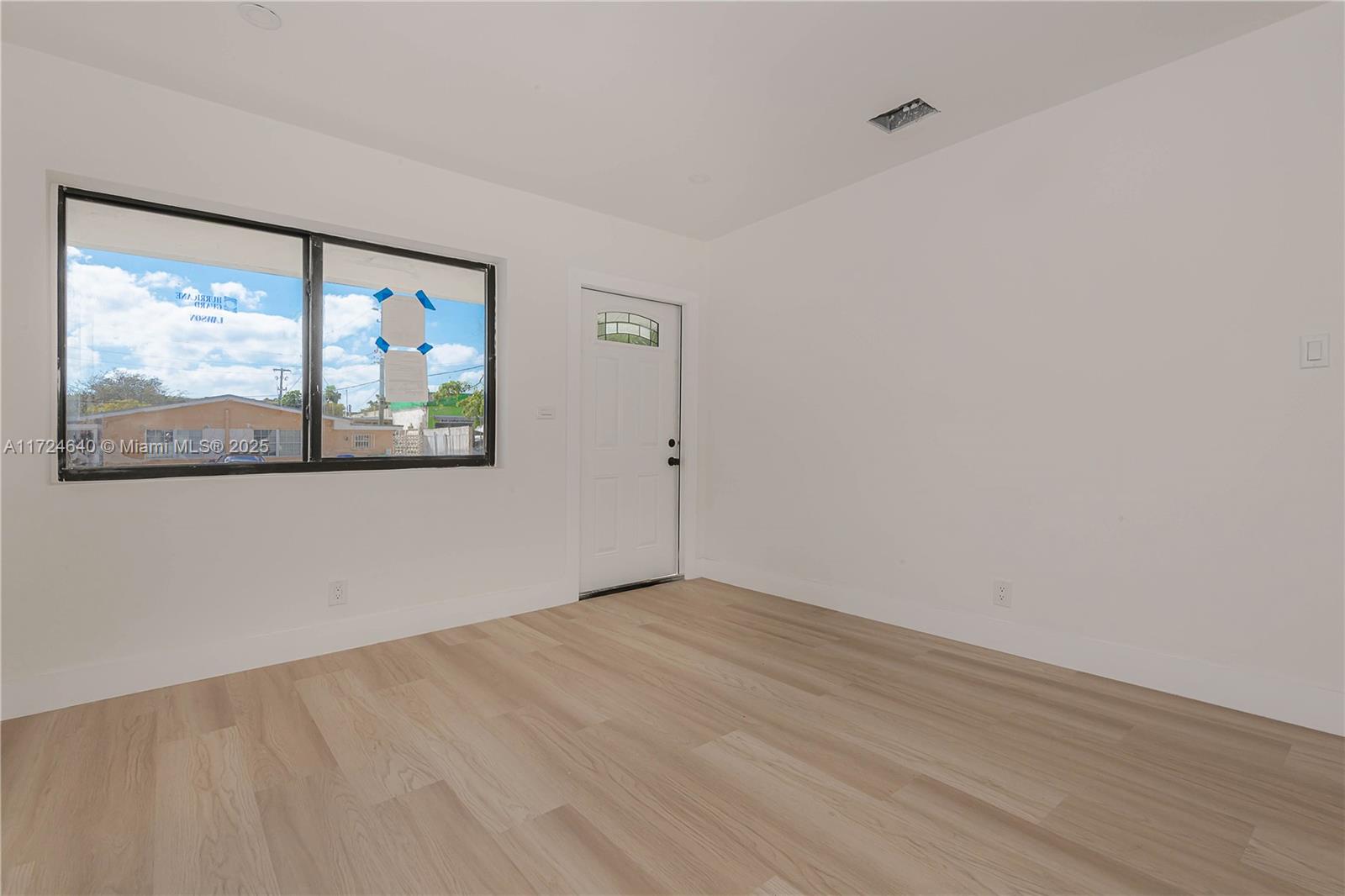 Coral Gate Miami, FL 33135 - Photo 8 of 23 wooden floor in an empty room with a window