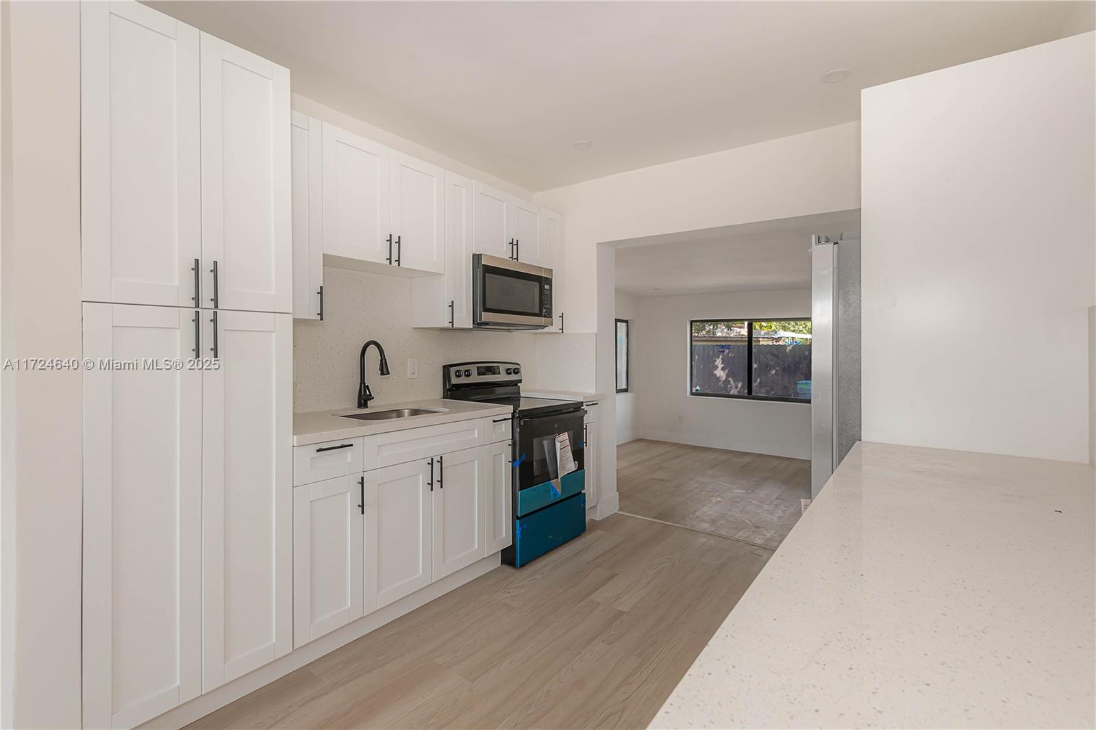 Coral Gate Miami, FL 33135 - Photo 9 of 23 a kitchen with cabinets and a stove top oven