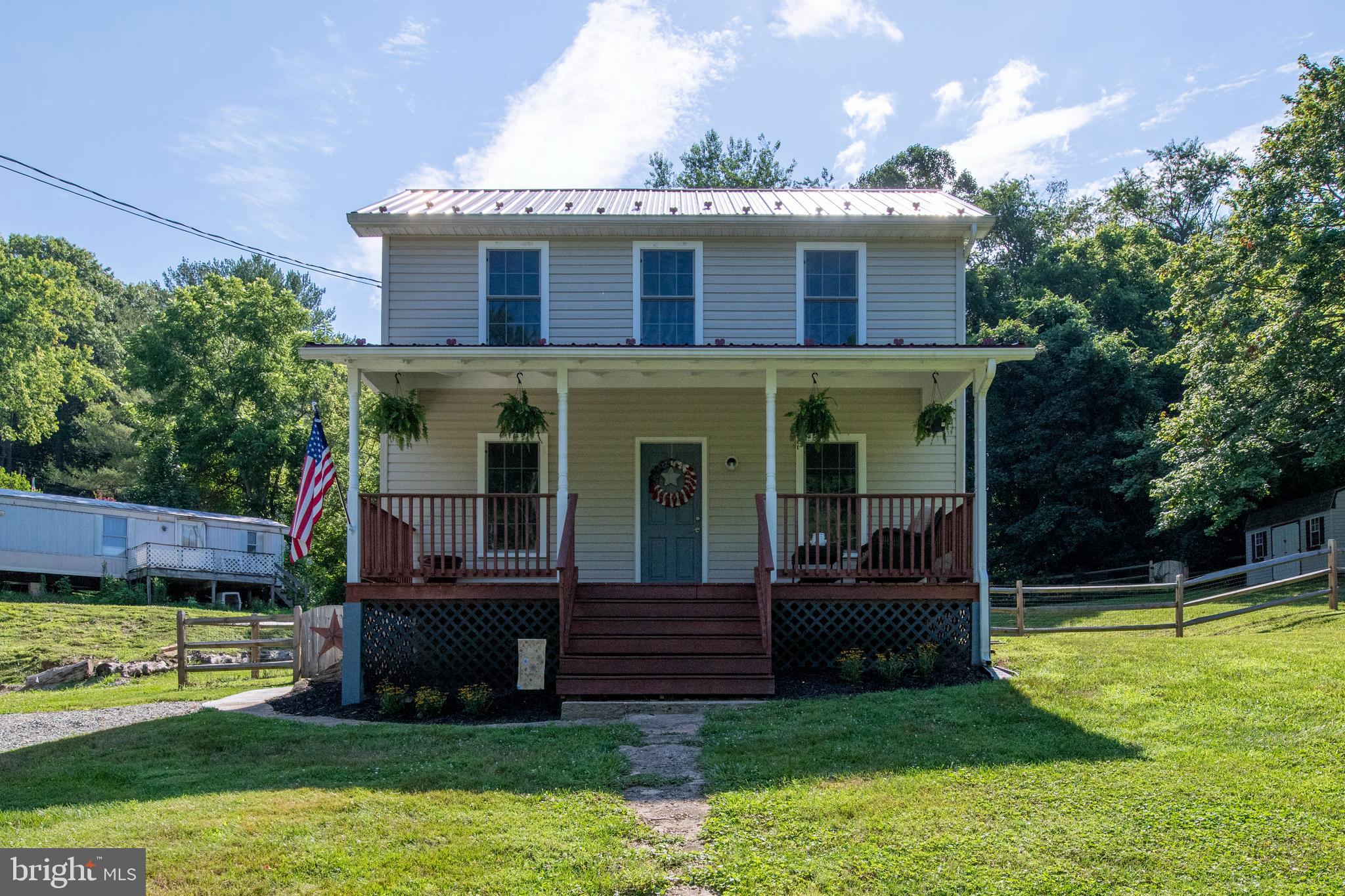 909 Old Pylesville Road Pylesville, MD 21132 - Photo 5 of 61 Step up and enjoy the front porch.