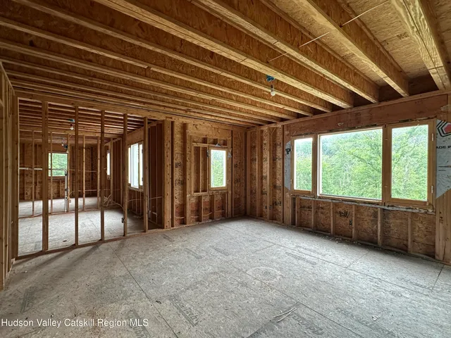 a view of an empty room with a balcony