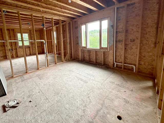 a view of an empty room with a balcony