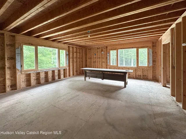 a view of an empty room with wooden walls