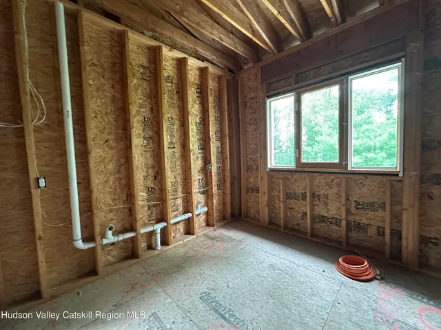 a view of an empty room with a staircase