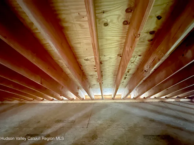 a view of a house with backyard and trees