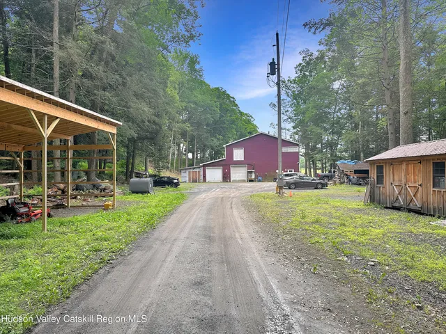 a kitchen with stainless steel appliances granite countertop a sink a cabinets and a window