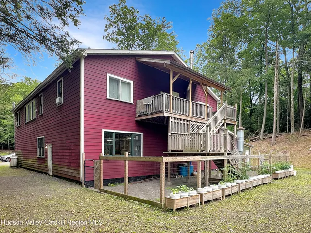 a kitchen with granite countertop white cabinets and stainless steel appliances