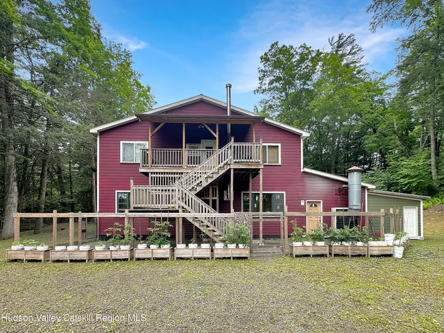 a kitchen with granite countertop white cabinets and stainless steel appliances