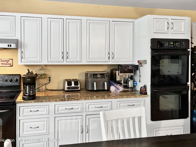 a room with gym equipment and a table
