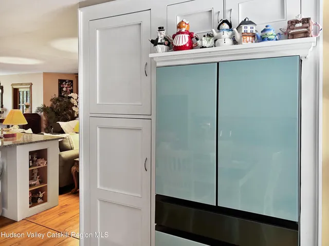 a large kitchen with stainless steel appliances a stove a sink dishwasher and a refrigerator