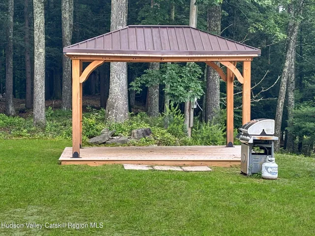 a view of a yard with a tree in a yard