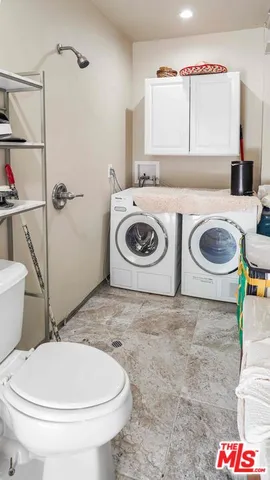 a bathroom with a toilet and a sink