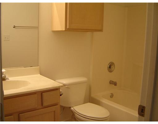15426 Cruiser Street, Unit B Corpus Christi, TX 78418 - Photo 5 of 6 a bathroom with a sink and a shower