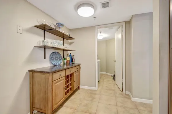 a hallway with a stove a washer and dryer
