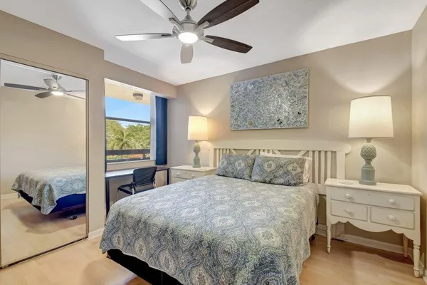 a bedroom with a large bed and a window