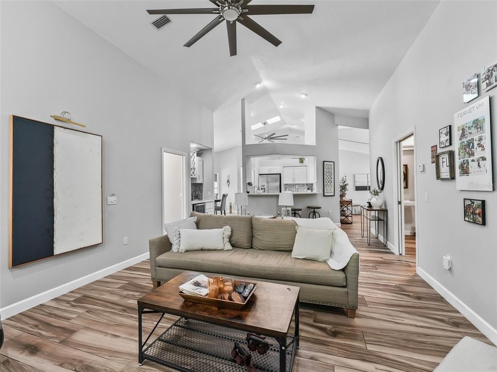 5714 Northwest 80th Ave Road Ocala, FL 34482 - Photo 15 of 39 a living room with furniture and a wooden floor
