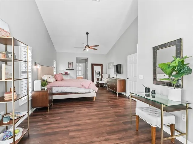 a spacious bathroom with a bathtub sink and mirror