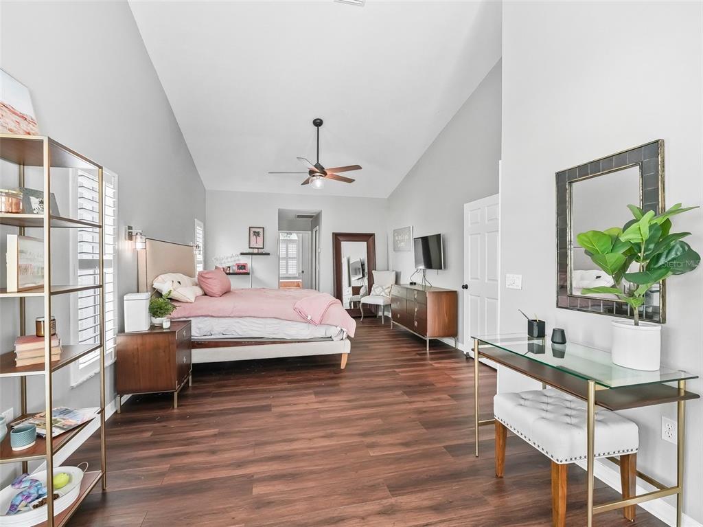 5714 Northwest 80th Ave Road Ocala, FL 34482 - Photo 19 of 39 a bedroom with furniture and a wooden floor