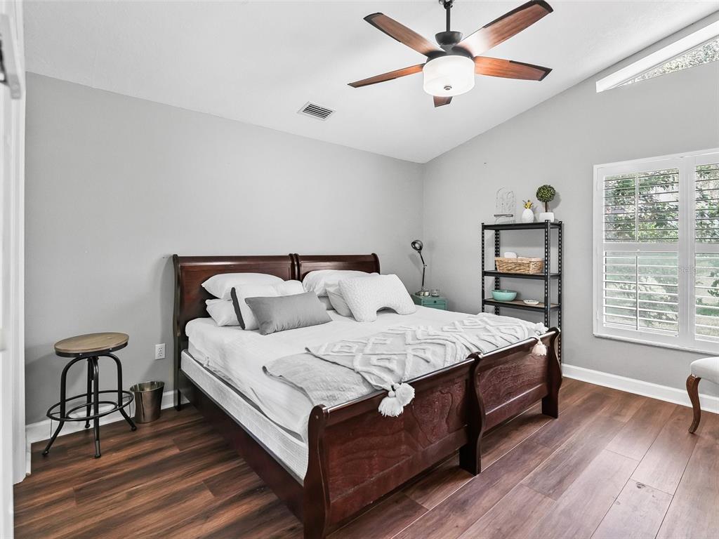 5714 Northwest 80th Ave Road Ocala, FL 34482 - Photo 23 of 39 a bed room with a bed and a window