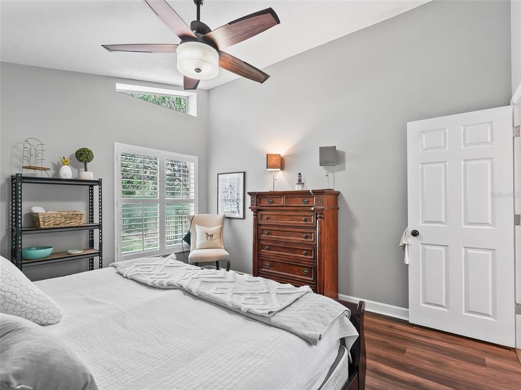 5714 Northwest 80th Ave Road Ocala, FL 34482 - Photo 24 of 39 a bedroom with a bed and a fireplace