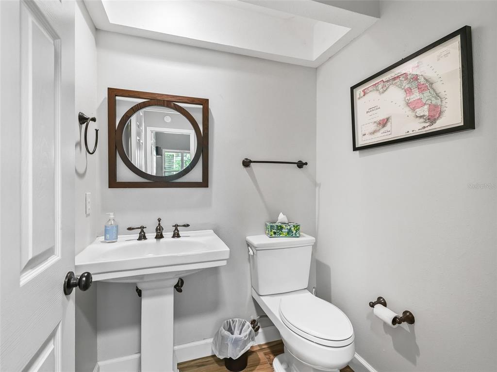 5714 Northwest 80th Ave Road Ocala, FL 34482 - Photo 25 of 39 a bathroom with a toilet a sink and mirror